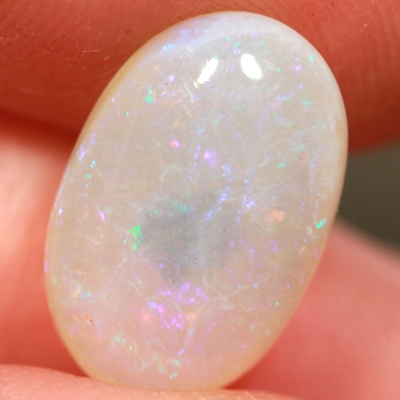 SOLID CRYSTAL OPAL Pinfires of pinks and greens throughout